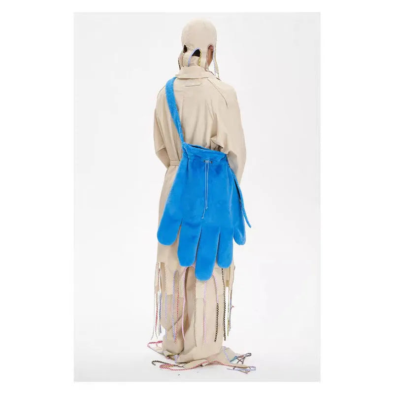 Blue fur 14-inch crossbody bag with velvet lining and sewing thread details, shown on a model for scale
