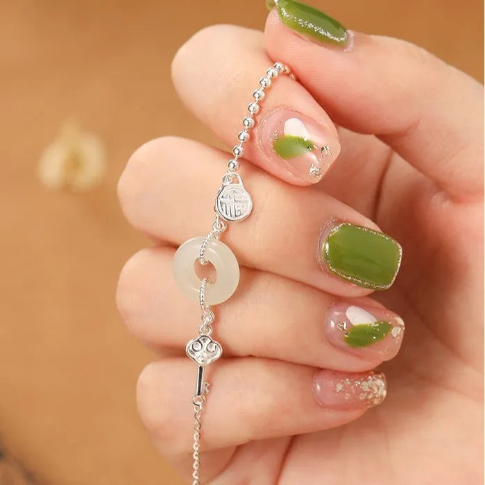 Women's Hetian jade bracelet in 925 silver with peace buckle charm, geometric Chinese style design