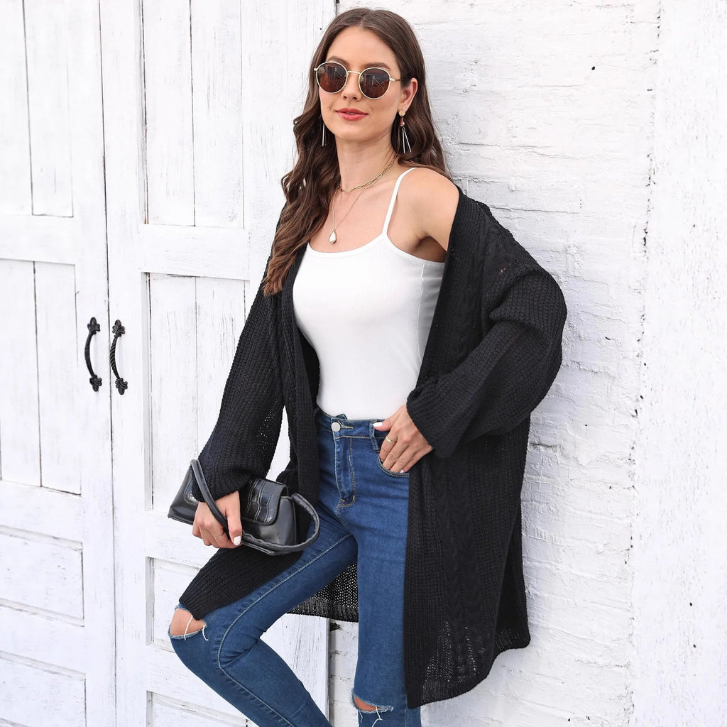 Women's loose brown acrylic sweater coat showing front detail and casual fit.