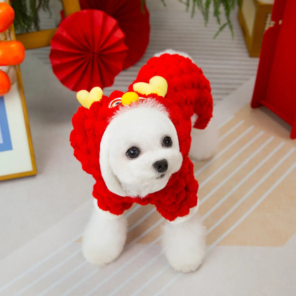Red fluffy pet jacket with cartoon dragon design for small dogs and cats on a white background.