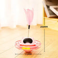 Pink cat tumbler turntable toy measuring 17 cm by 10 cm on a flat surface