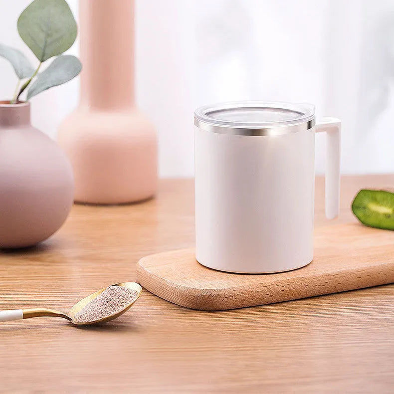 White automatic stirring coffee cup with magnetic base and stainless steel interior