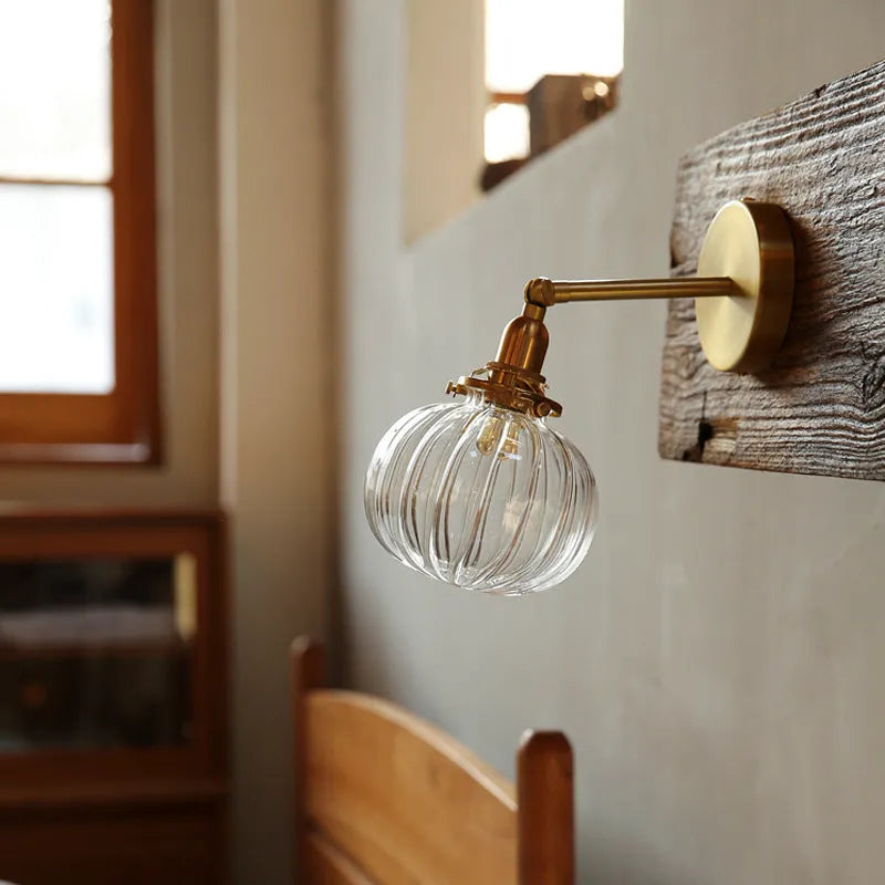 Pumpkin-shaped decorative glass wall lamp in water ripple transparent or solid blue finish.