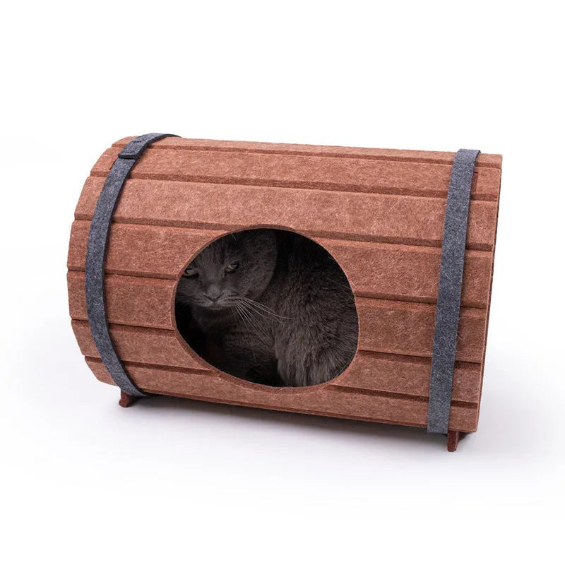 Assembled wine barrel cat bed with three felt panels forming circular pet nest
