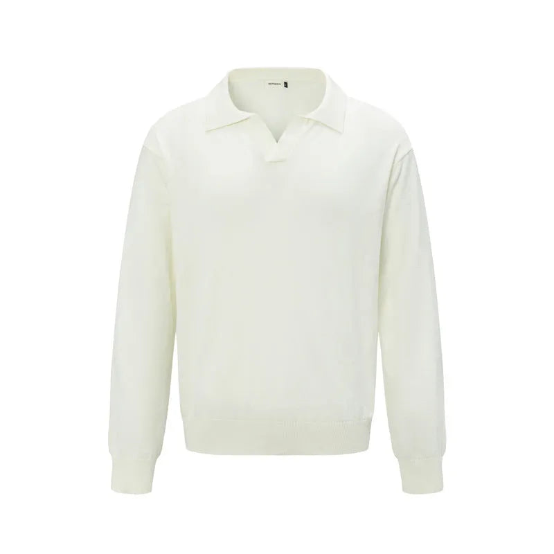 Loose-fitting pullover sweater in black, dark grey, and creamy-white colours