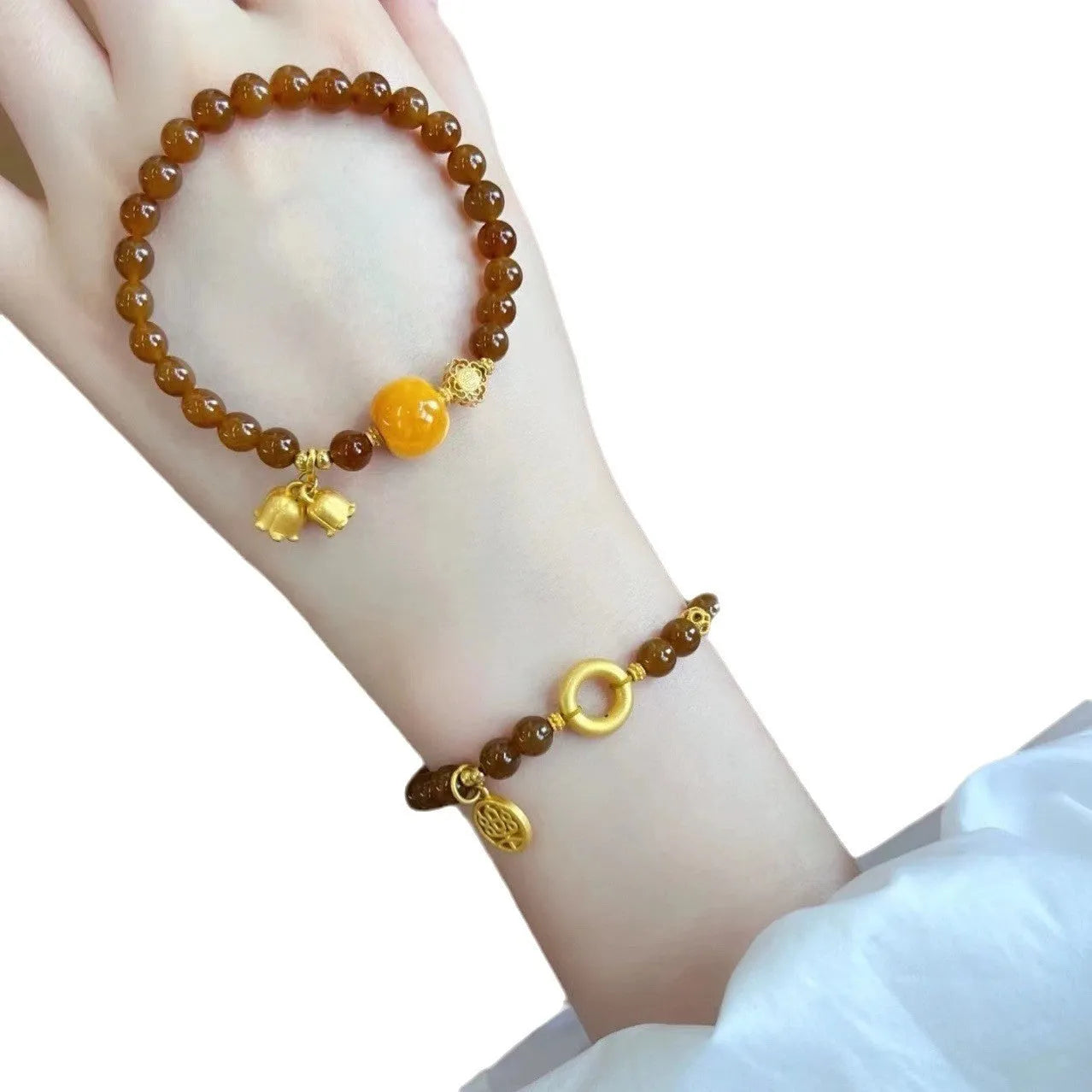 Women's natural stone Lily bracelet with electroplated finish and floral design in caramel beeswax colour