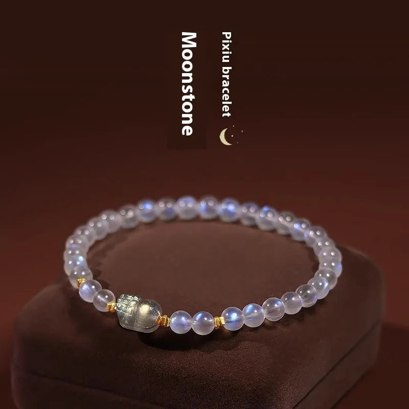 National style moonstone bracelet with animal zodiac design showing blue light fashion effect