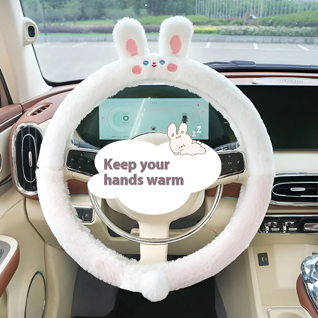 Plush rabbit fur steering wheel cover with embroidered panda design, shown fitted on a car wheel.