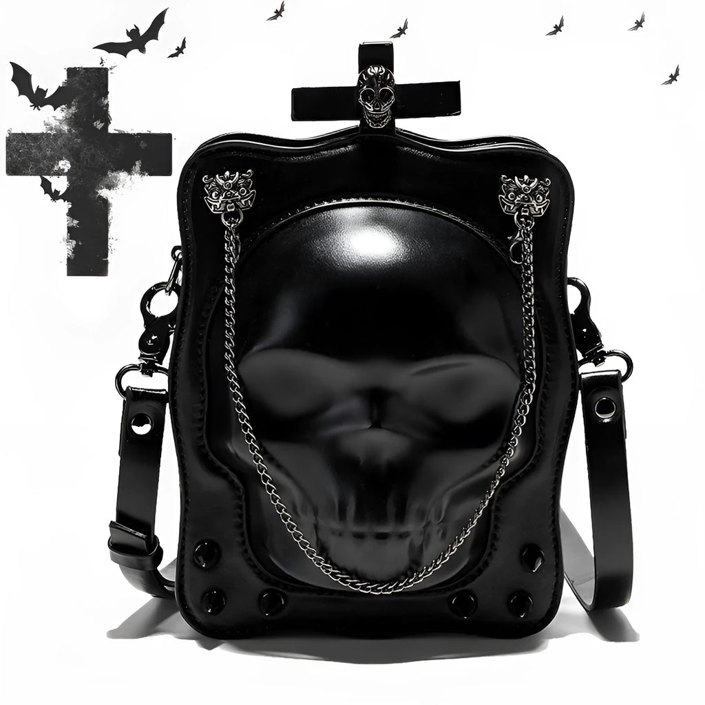 Black mini square crossbody bag with detailed skull embossing, rivets, and a shoulder strap.