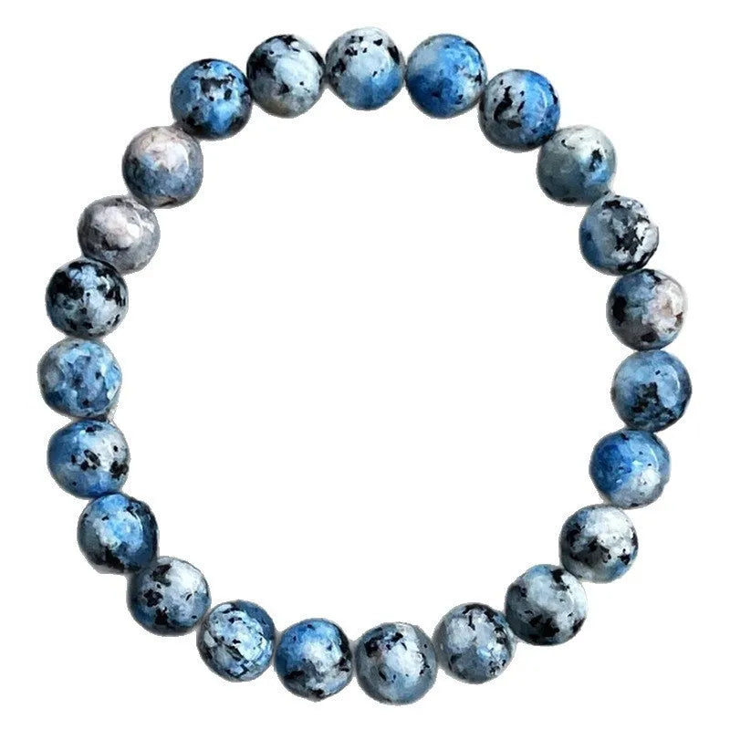 Handmade blue-green K2 Azurite stone bracelet with geometric beads on a wrist.