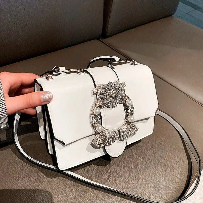 Women's designer diamond lock shoulder bag in quality PU leather, available in Black and Blanco colour options
