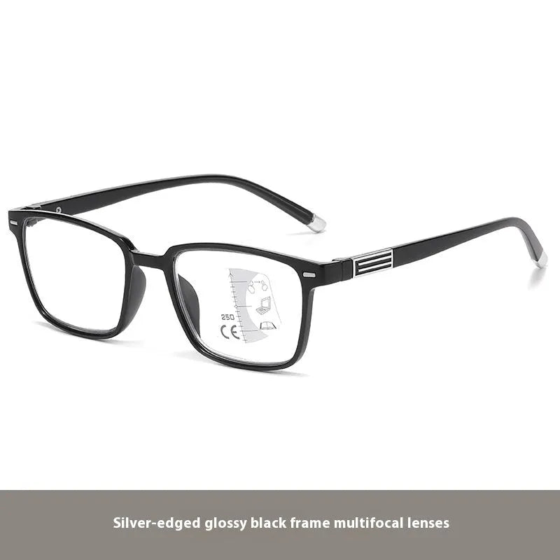 A pair of multifocal reading glasses with colour changing, anti blue light PC lenses in a black and silver frame style.