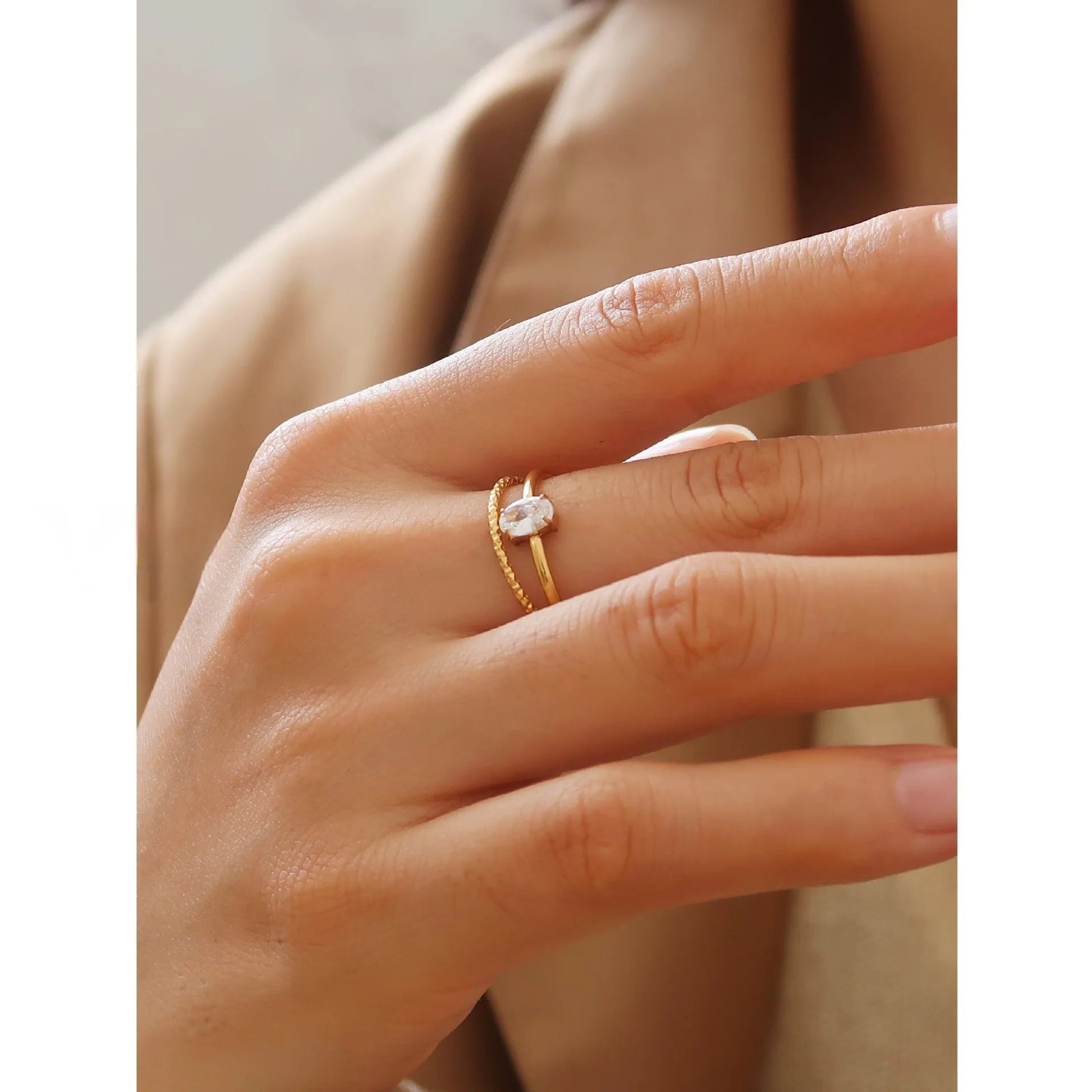 Women's golden electroplated stainless steel ring showing both love heart and oval shape variations