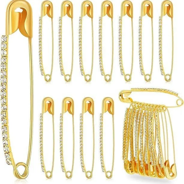 Gold and silver rhinestone flower brooch pins for scarf fixation on white background