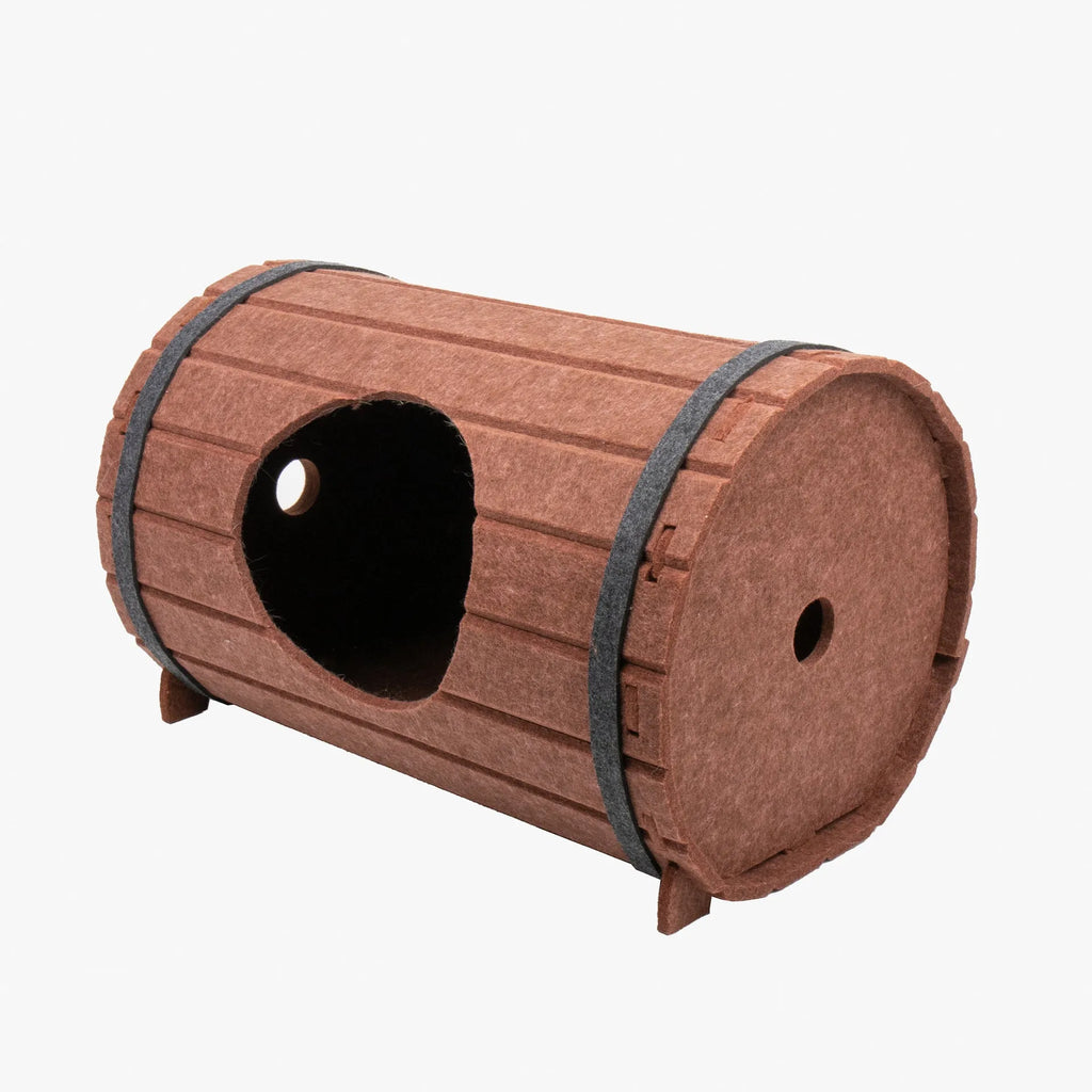 Assembled wine barrel cat bed with three felt panels forming circular pet nest