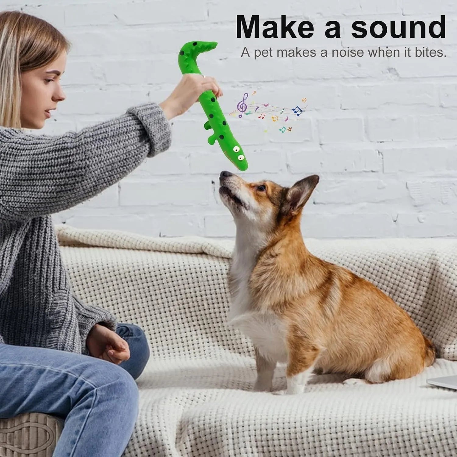 Green lizard-shaped dog chew toy with squeaker function for dental play