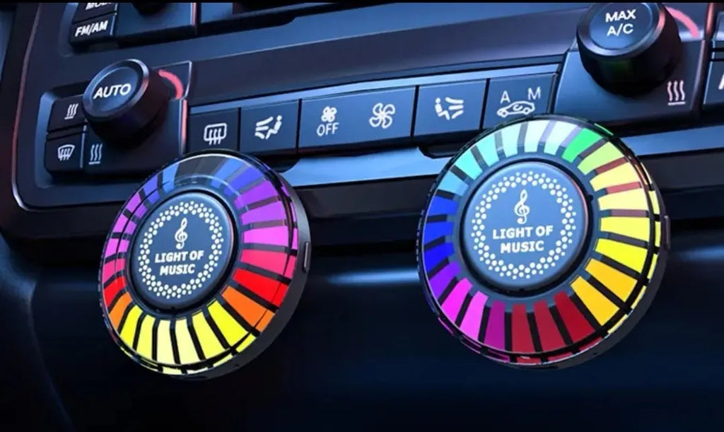 RGB car air outlet aromatherapy light with 3D rhythm effects mounted in a car vent.