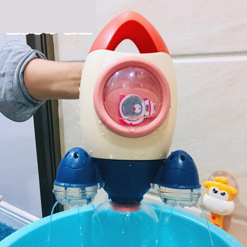 Dinosaur-shaped baby bath toy with manual water spray function in bright colours