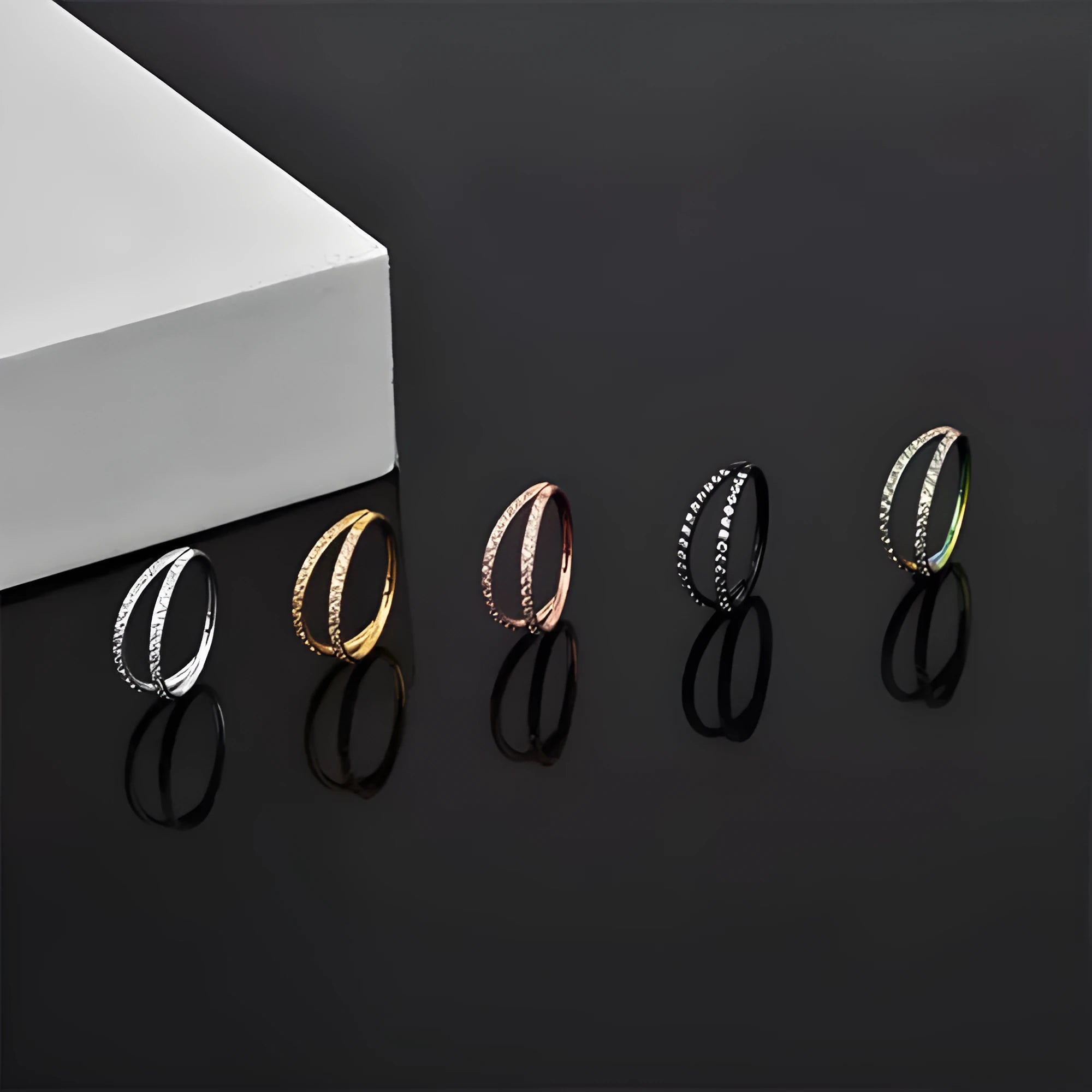 Titanium alloy nose ring with G23 purity and diamond-treated zircon surface in gold or steel colour