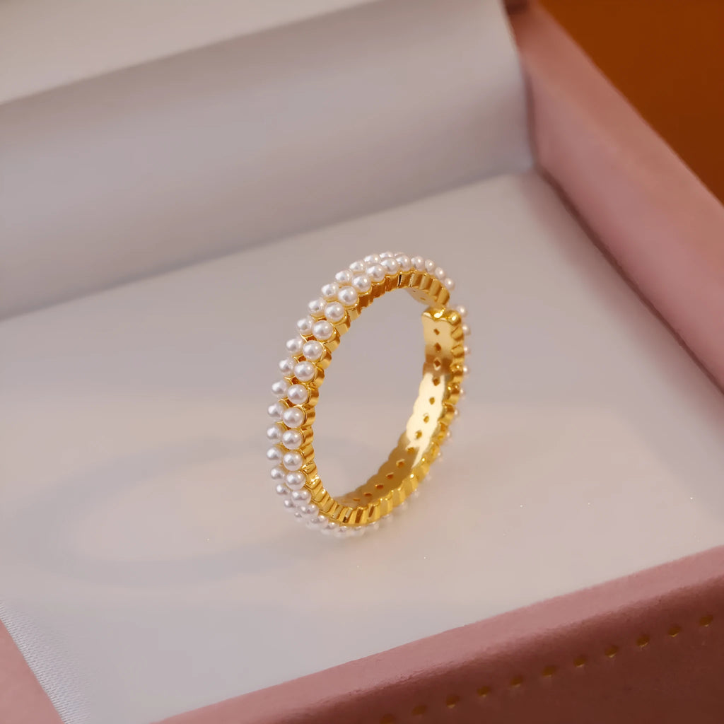 Gold geometric women's ring with open mouth design and round pearl element