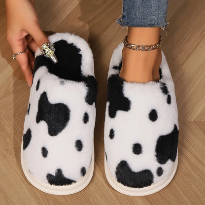 A pair of cozy, plush slippers with a unique spotted pattern, designed for warm and comfortable indoor wear.