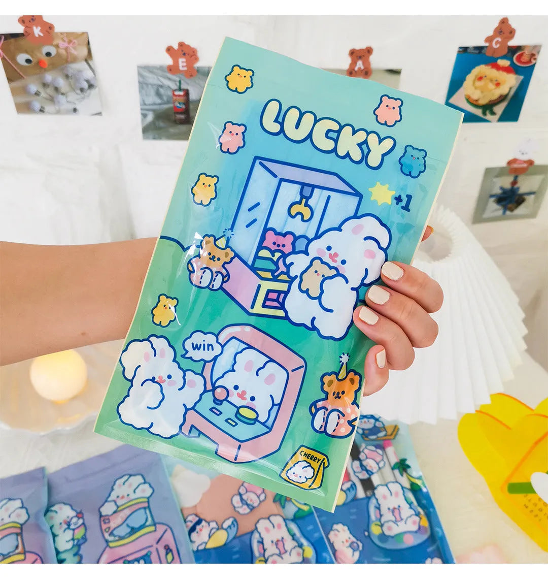 Green, blue, purple and pink rectangle packaging bags with cute rabbit designs for snacks and gifts.