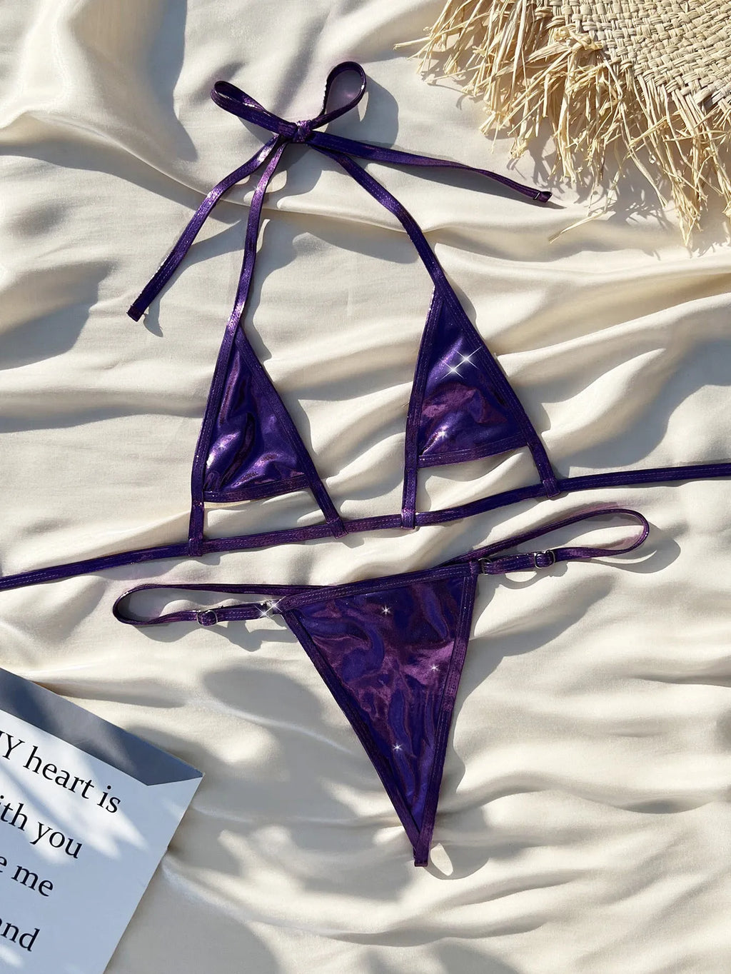Purple metal pearlescent lace-up micro bikini on female model, split sides, polyester swimwear set