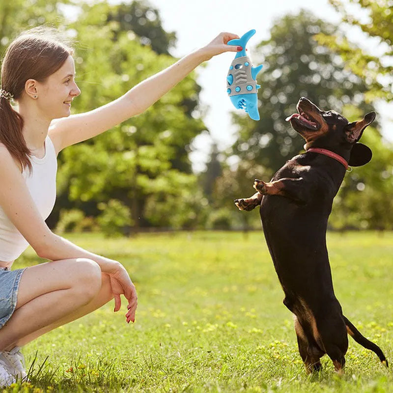 Blue dog teething toy with shark-tooth textured surface and visible air vents for bite-resistant chewing