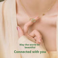 Handmade sterling silver bamboo joint peace buckle necklace with pearl details on an O-chain.