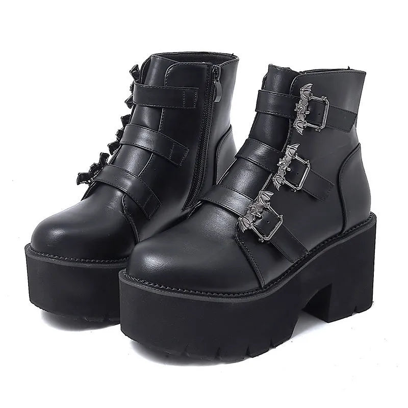Black women's Harajuku-style punk ankle boots with bat buckle and chunky platform heel.
