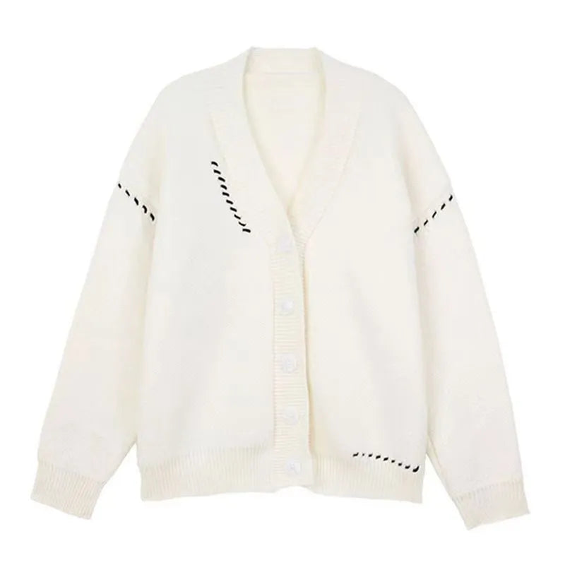 Women's loose fit long sleeve knitted cardigan coat in black or white.