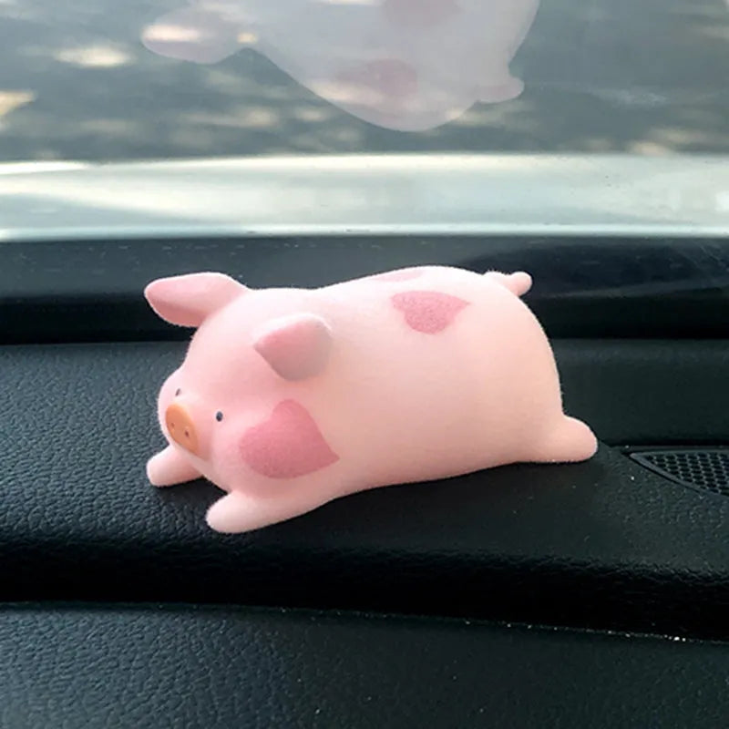 Resin cartoon pig car dashboard decoration ornament in one of eight available styles.