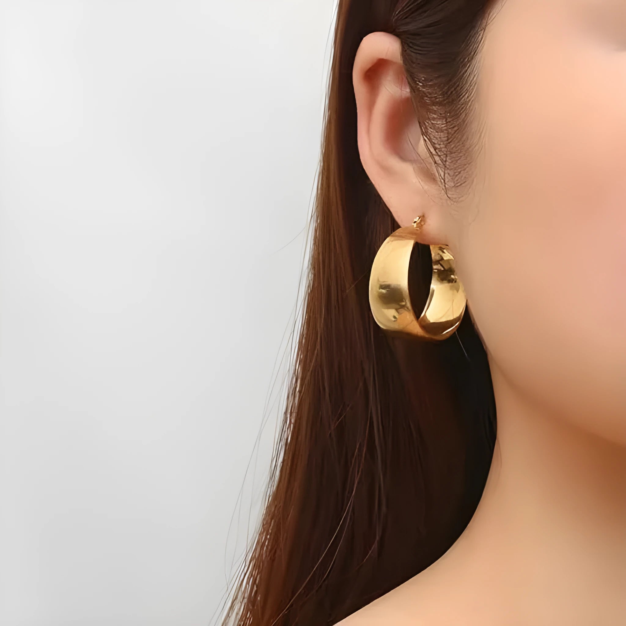 Widened curved stainless steel earrings in steel or gold colour, 25mm or 30mm size