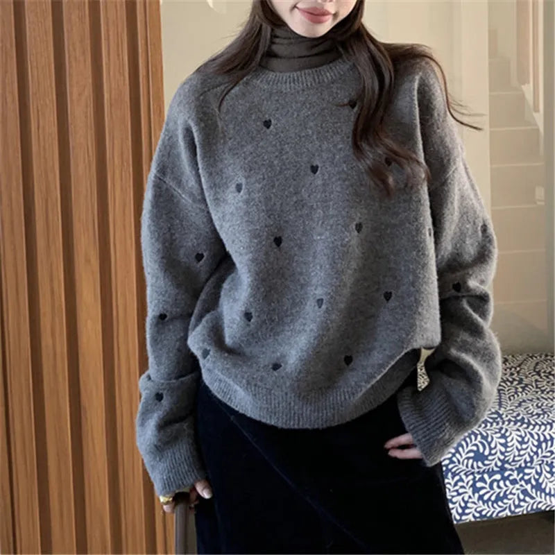 Beige loose-fit women's acrylic pullover sweater with long sleeves and chest embroidery.