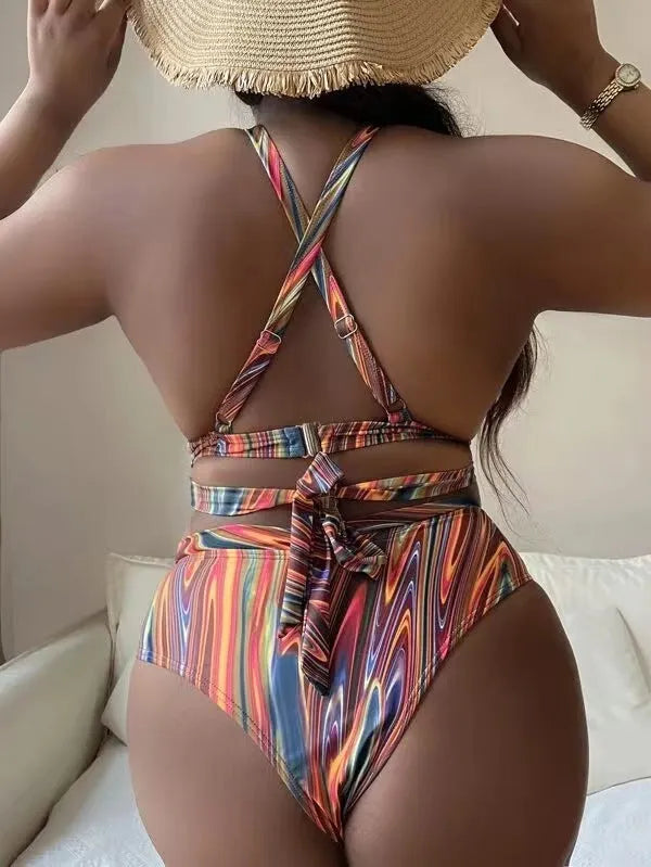 Women's floral print high-waisted bikini swimsuit with split sides.