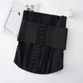 Black nylon waist training slimming belt laid flat, showing adjustable strap.