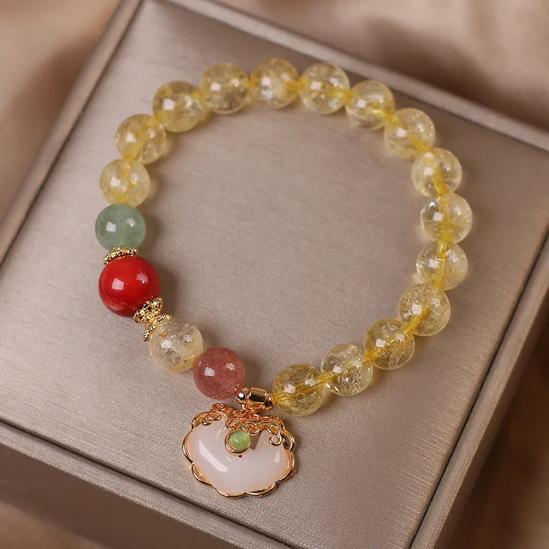 Women's alloy bracelet with a yellow natural citrine jade ruyi pendant.