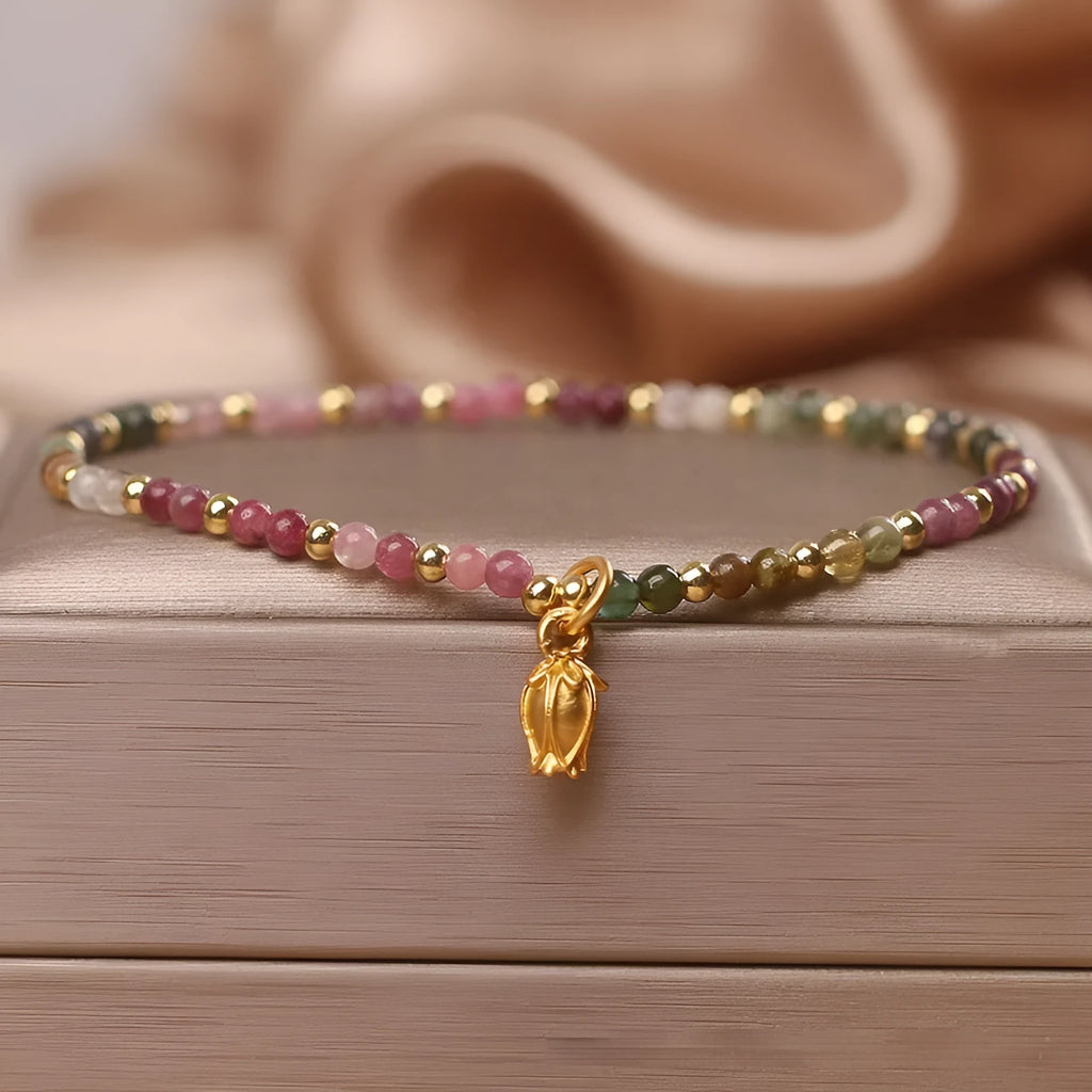 Green tourmaline floral bead anklet with adjustable chain on woman's ankle