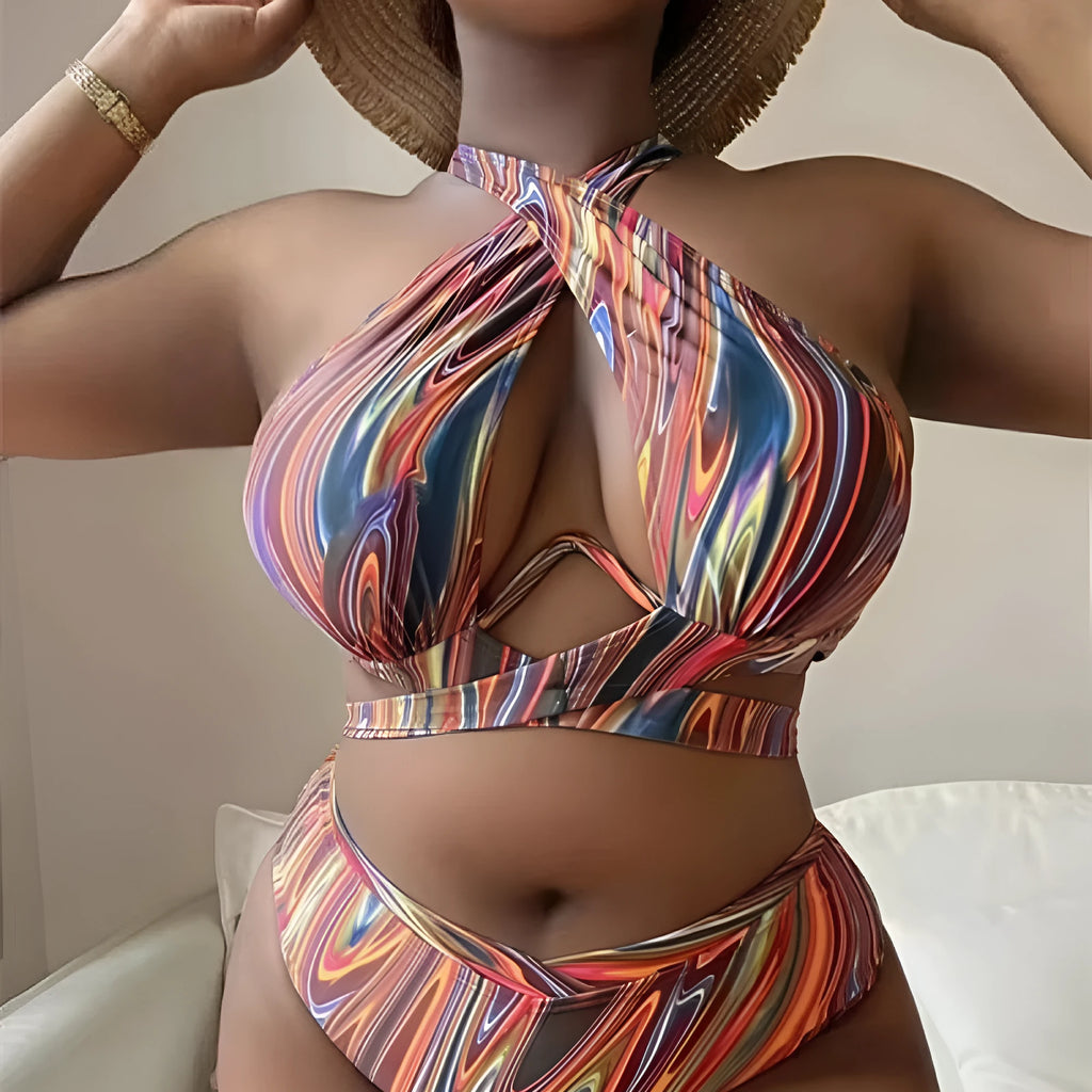 Women's floral print high-waisted bikini swimsuit with split sides.