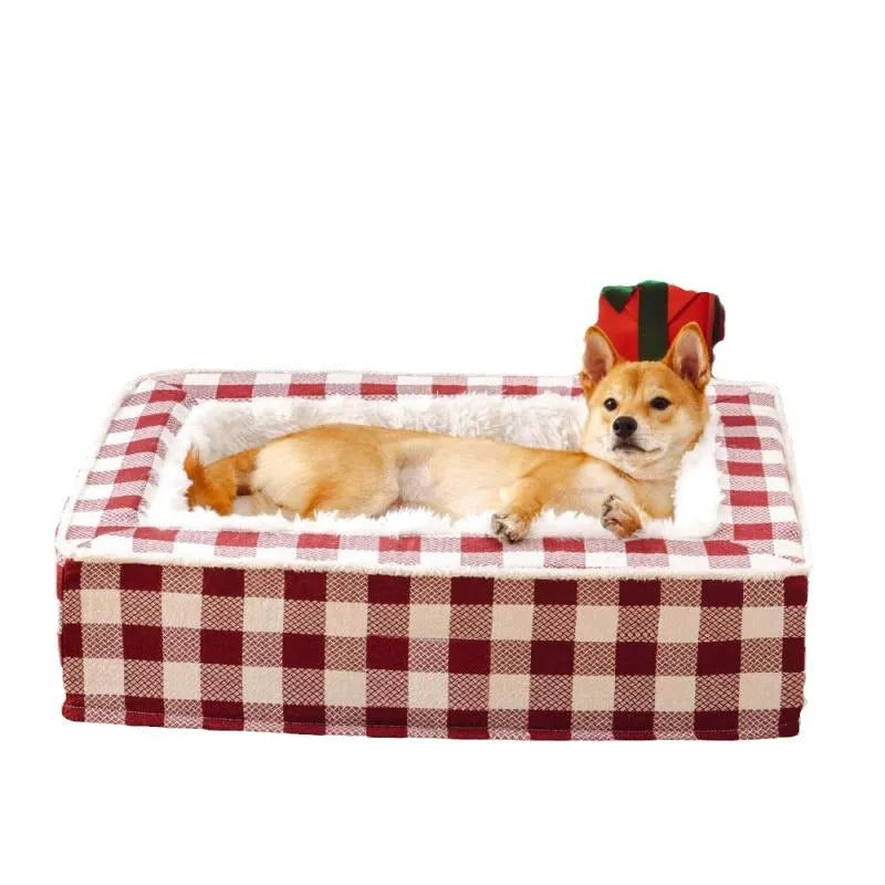 Classic plaid pattern dog cushion with removable cover in red, shown next to a black crate.