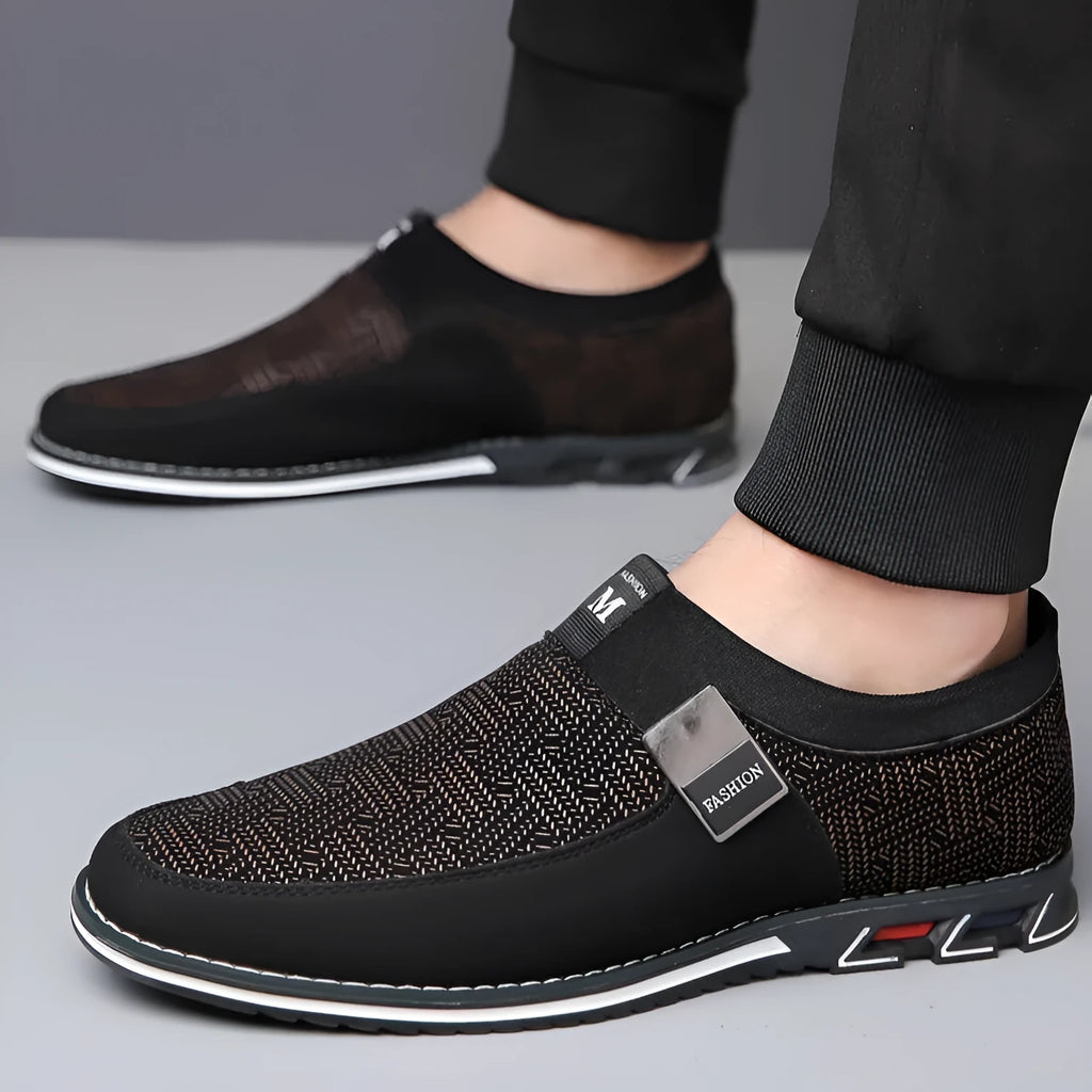 Men's black synthetic leather slip-on casual shoes with a square toe and flat rubber sole.