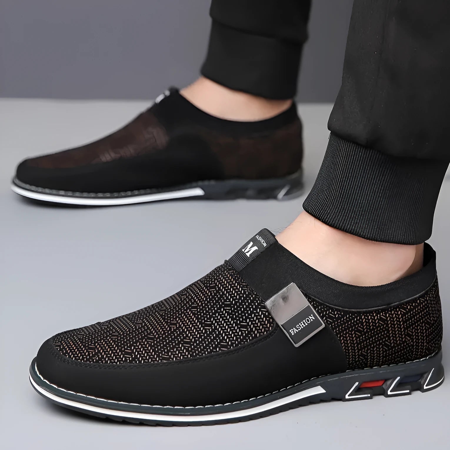 Men's black synthetic leather slip-on casual shoes with a square toe and flat rubber sole.
