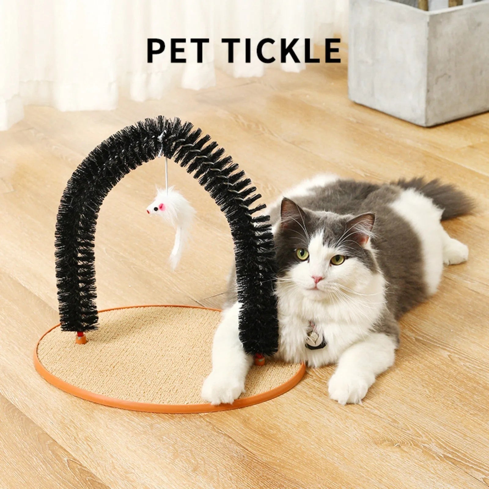 Black arch-shaped cat grooming brush with attached plush mouse toy on non-slip scratching base