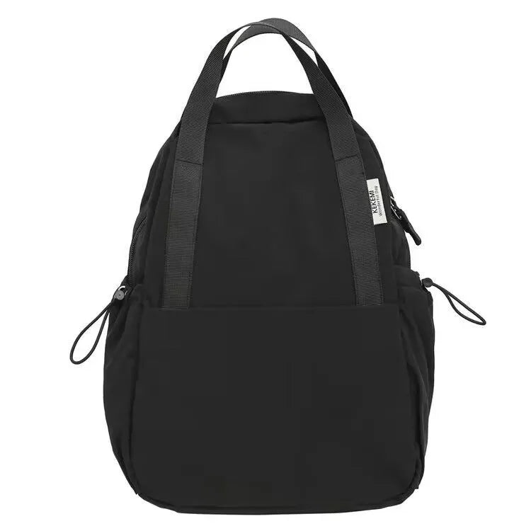 Solid colour ultra-light waterproof nylon backpack with curved shoulder straps on a white background