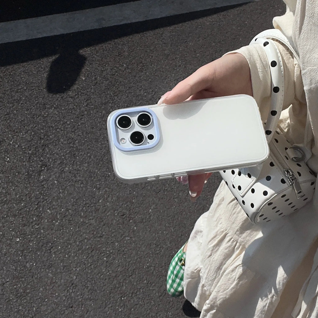 Clear jelly iPhone phone case in solid blue colour on an iPhone, showing bumper-style all-inclusive protection.