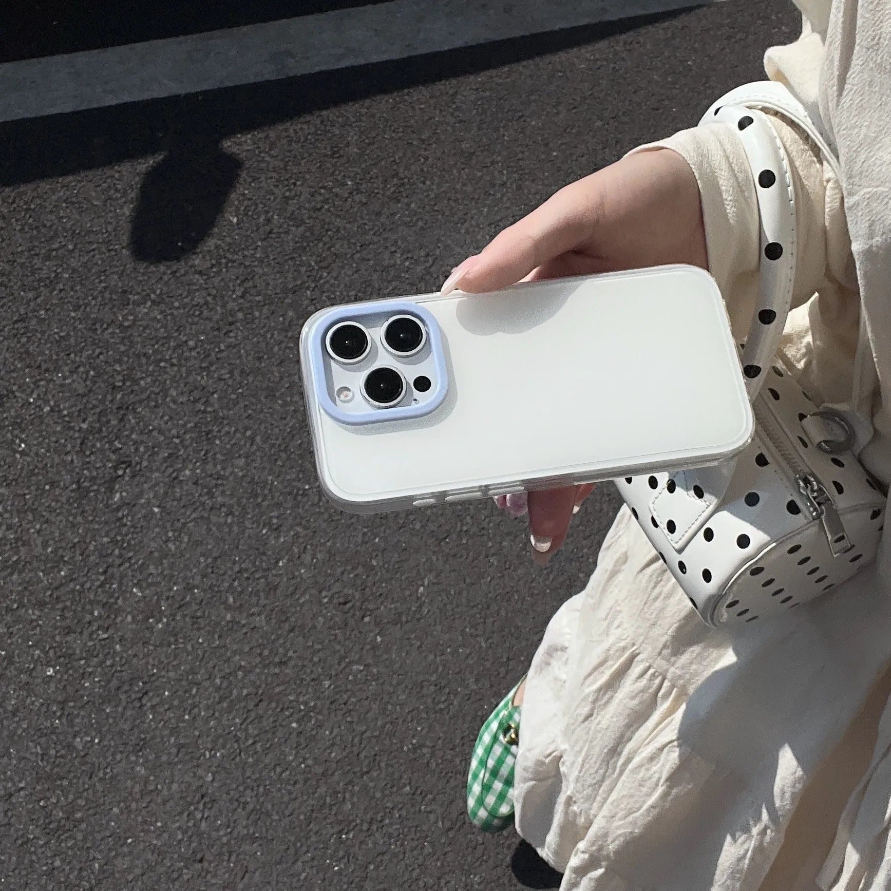 Clear jelly iPhone phone case in solid blue colour on an iPhone, showing bumper-style all-inclusive protection.