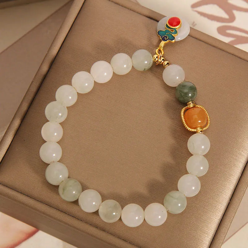 Women's ice jade bracelet with pearl accents and traditional jade buckle