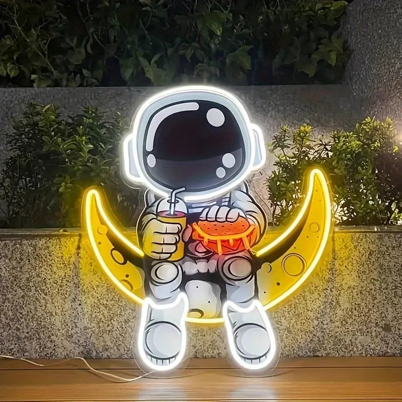 Wall mounted astronaut LED neon light with moon design and lemon yellow accents measuring 30x35cm