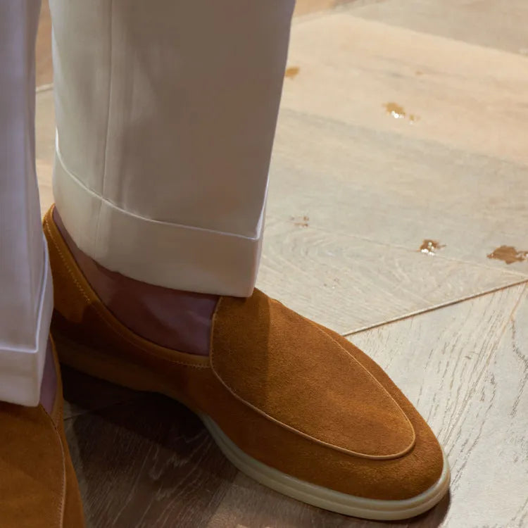 Men's handmade brown leather loafers with a low tube design and light TPR sole.