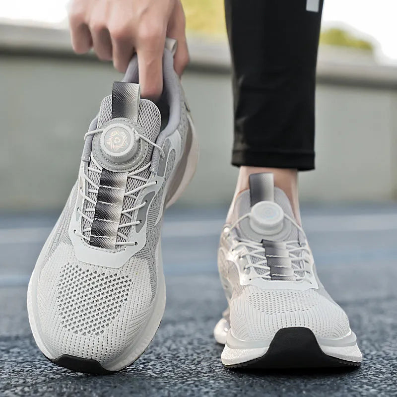Men's white Fly-knit mesh running shoes with a rotating buckle fastener and TPU sole.